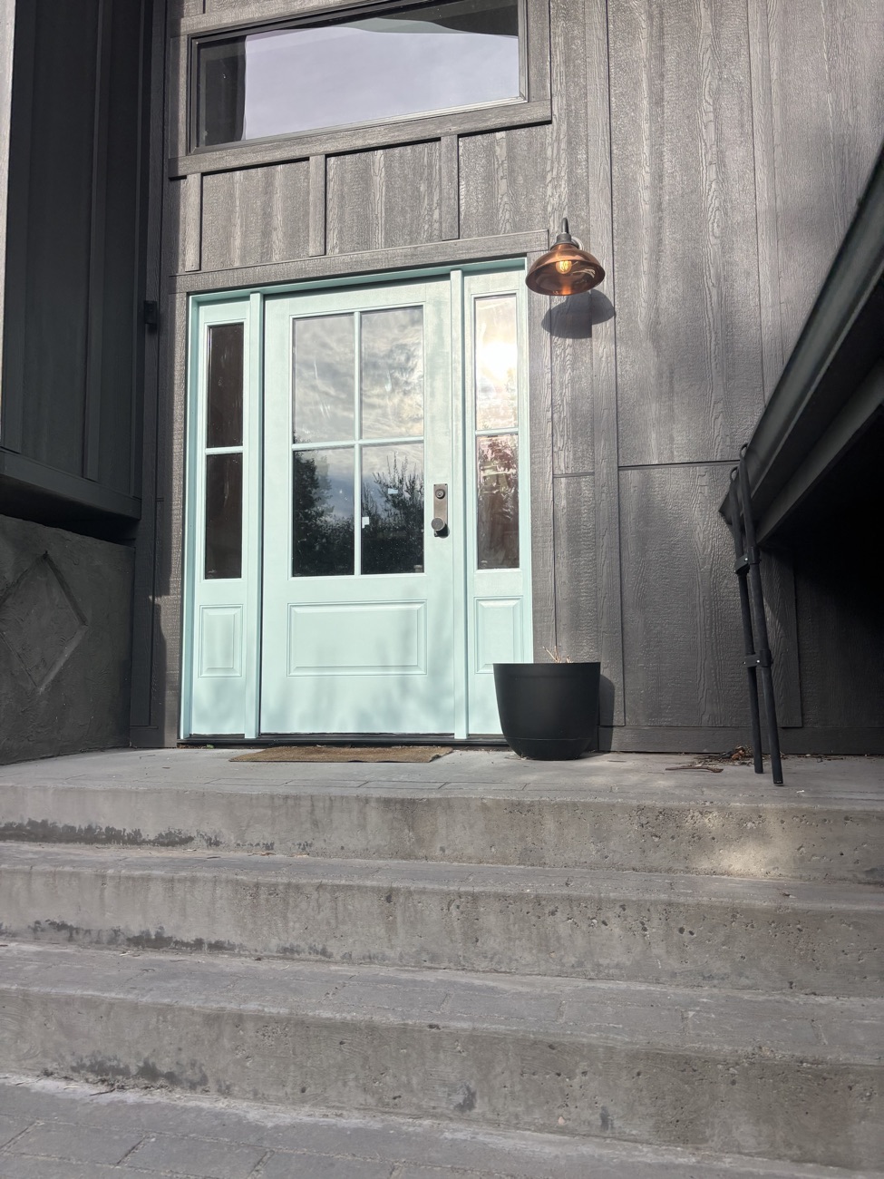 Front entry door and sidelights painted light blue